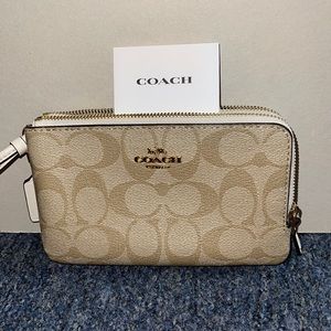 Brand new never used!! Tan & white coach wristlet!